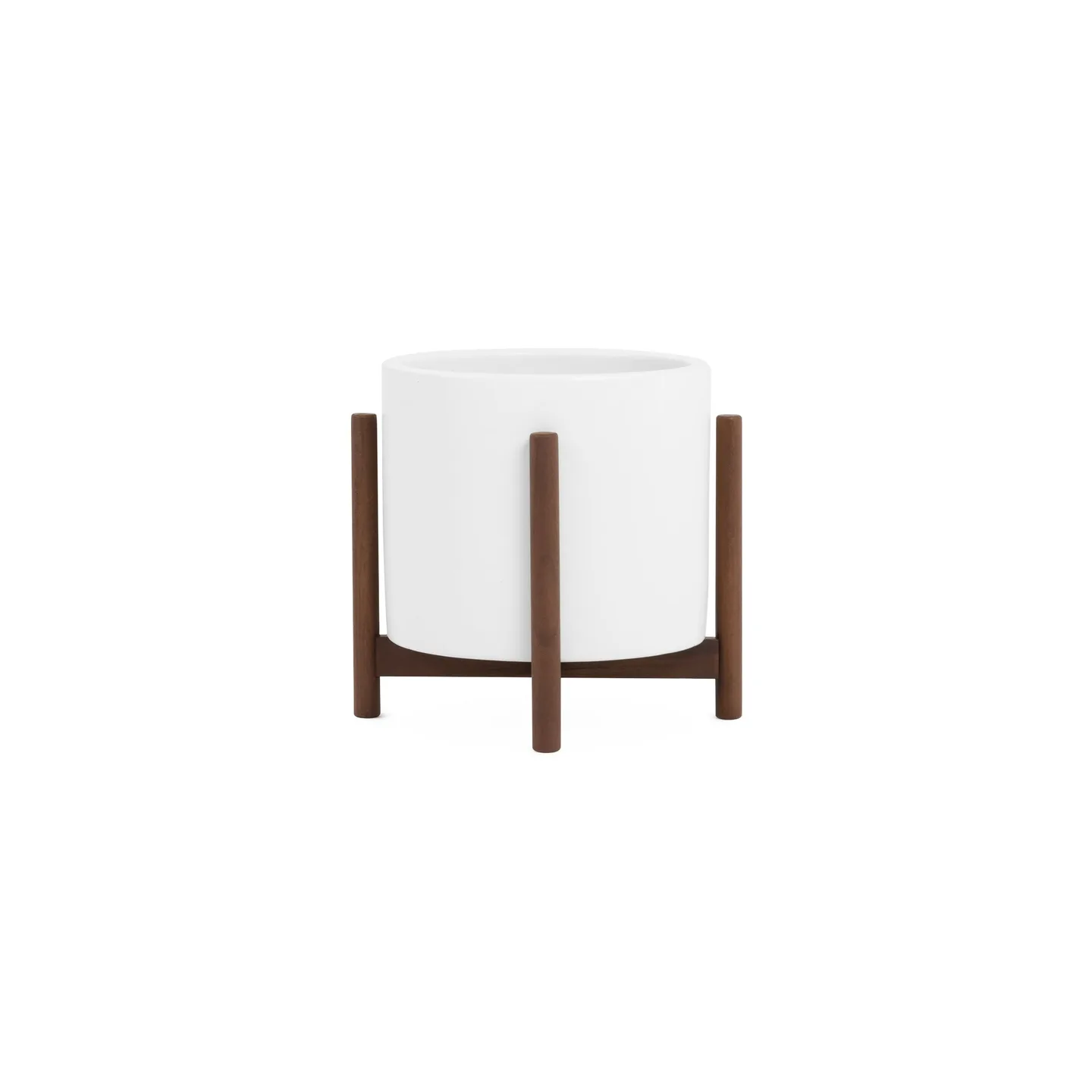 White Modernica Case Study Cylinder Planter on a teak stand.